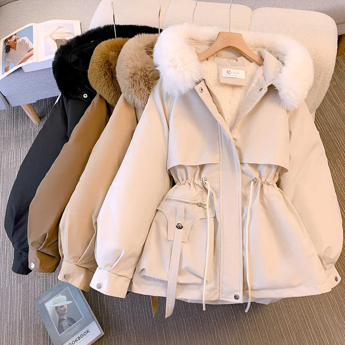 Women's winter jacket with hood, tailored fit, zippered pockets, and elegant silhouette