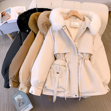 Women's winter jacket with hood, tailored fit, zippered pockets, and elegant silhouette