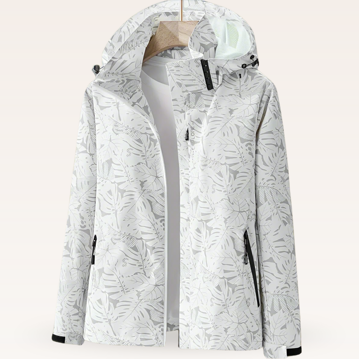 Lightweight waterproof jacket for women with adjustable hood and leaf pattern
