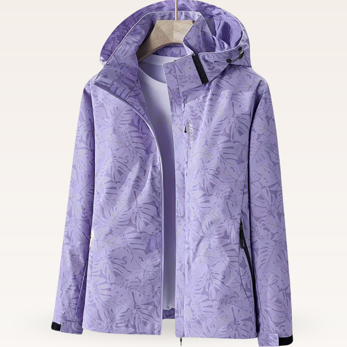 Lightweight waterproof jacket for women with adjustable hood and leaf pattern